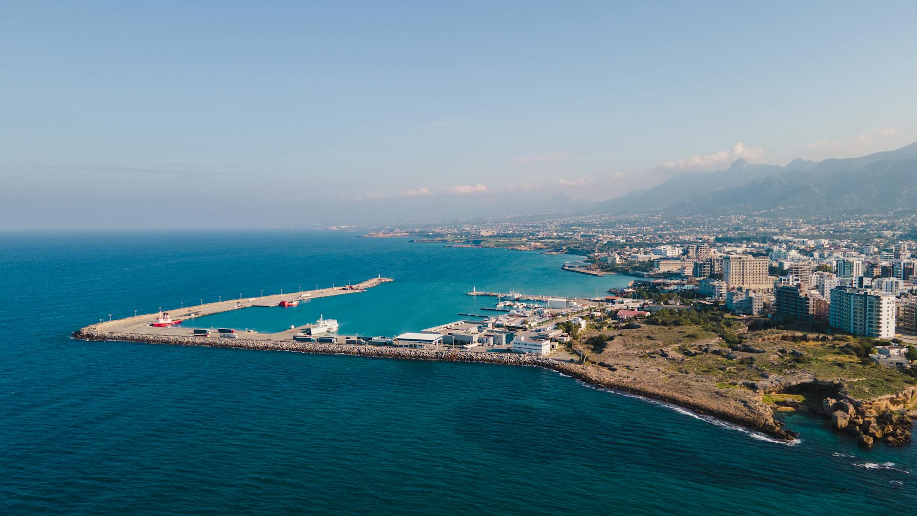 aerial view of city buildings near body of water