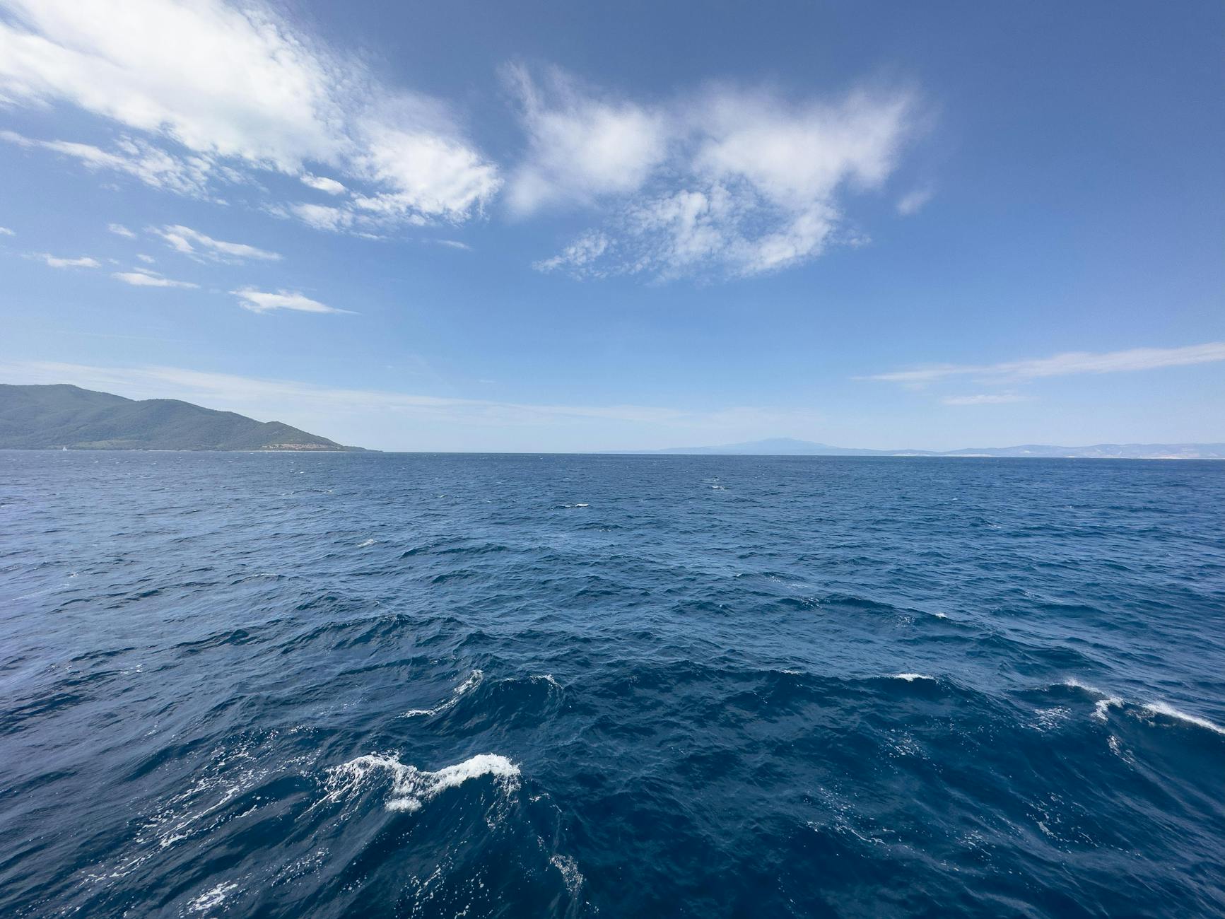 blue sky over the undulating sea